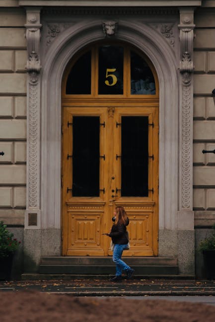 Classic arched doorway with number five representing the heritage and entry to prosperity